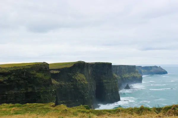 stock image a poor weather day of The Cliffs of Moher overlooking the Atlantic Ocean in County Clare, Dublin, Ireland