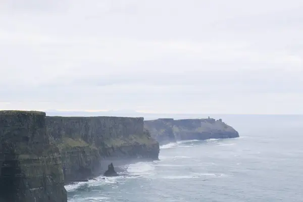 stock image a poor weather day of The Cliffs of Moher overlooking the Atlantic Ocean in County Clare, Dublin, Ireland