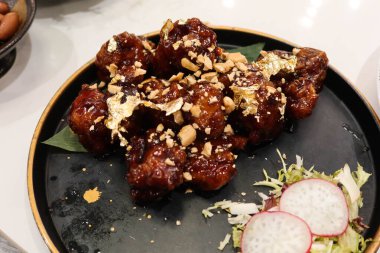 close up of Chinese Hong Kong Cantonese style deep fried pork ribs with Balsamic black vinegar clipart