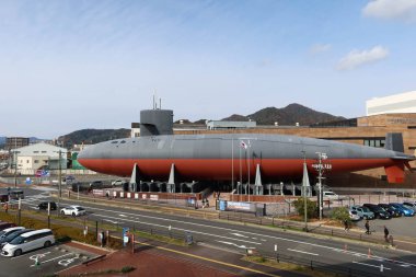 Kure, Hiroshima, Japan- 13 Dec 2024: exterior of Submarine Akishio located in Japan Maritime Self-Defense Force (JMSDF) Kure Museum in daytime with copy space  clipart