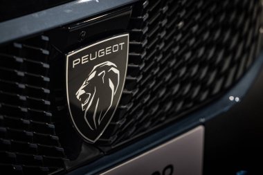 Modern Peugeot Badge and Grill Close-up - Detailed Peugeot Car Emblem for Automotive Editorial Content clipart