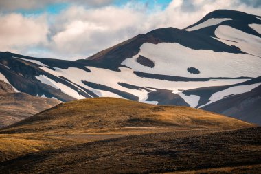 Majestic volcanic mountain and hill in remote wilderness on geothermal area in summer at Highlands of Iceland