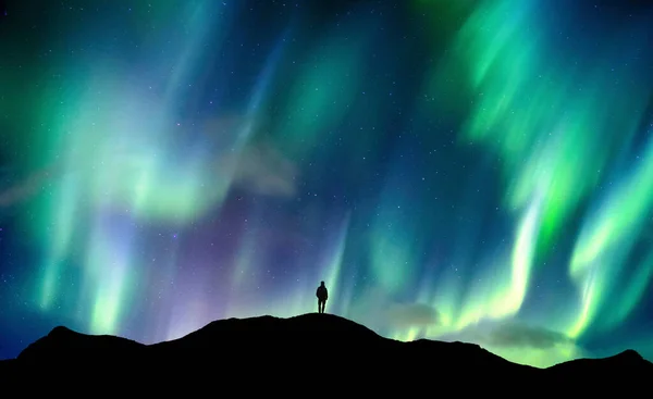 Beautiful Aurora Borealis Northern Lights Glowing Silhouette Hiker Standing Mountain — Stock Photo, Image