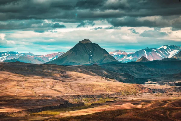 Volcano mountain on lava field and cloudy sky in Icelandic Highlands on summer at Iceland