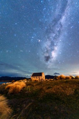 Fantastic nightscape of Milky Way, Nebula, Aurora Australis glowing over Church of the Good Shepherd at Lake Tekapo, New Zealand