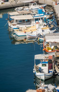 Vlichada beach bay, Santorini, Greece - August 2022 : Vertical view of the port with yachts and boats moored to shore
