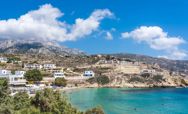 Lefkos Beach, Karpathos, Greece - August 2022 : White sandy beach and crystal clear water on a popular and beautiful greek beach