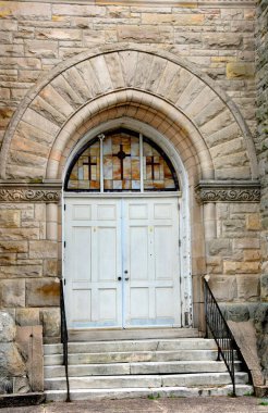 Historic Clayborn Temple was formerly the Second Presbyterian Church in Memphis, Tennessee.  Entry is stone arch and stained glass.  Crosses decorate glass. clipart