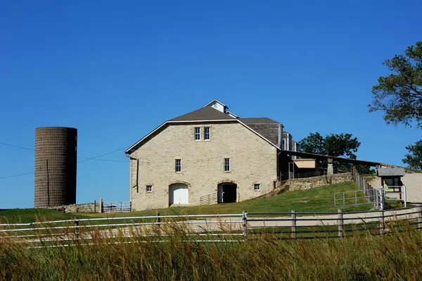 stock image Tallgrass Prairie National Preserve includes a large stone barn.  It is located on the Flint Hills National Scenic Byway.