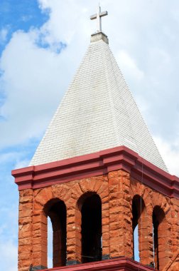 Bell town on the Grace Christian Church is designed with locally mined red sandstone.  It is located in Houghton, Michigan and is over 100 years old. clipart