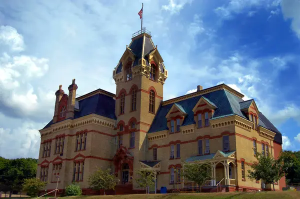 stock image Victorian era county courthouse in Houghton, Michigan is designed with local red sandstone and Lake Superior copper for the roof.  Houghton County Courthouse is over 120 years old.