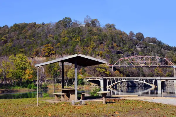 stock image Day Use are of the River Run Park on Bull Shoals Lake has small grill, picnic tables and a gorgeous view of lake and bridges.