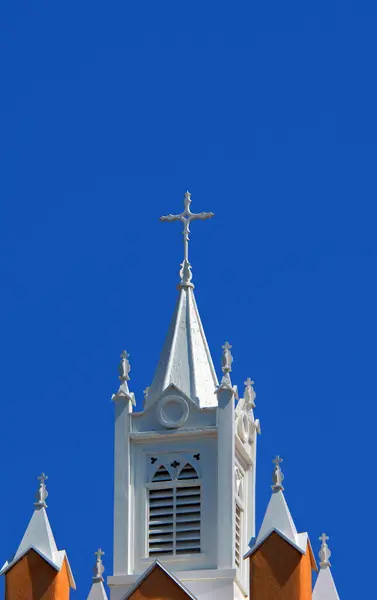 stock image Cross tops the bell tower on San Felipe de Neri Church in Old Town, Albuquerqu, New Mexico.