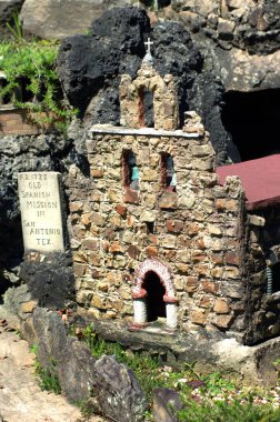 Old Spanish Mission recreated out of stone and concrete is displayed at the Ave Maria Grotto in Cullman, Alabama. clipart