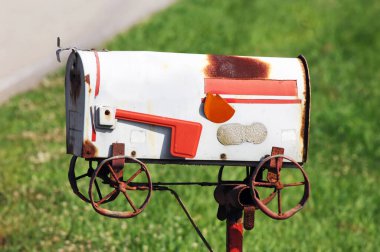 Metaphoric mailbox shows this family has moved.  Handmade mailbox design depicts a 