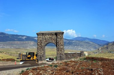 Entry through the Roosevelt Arch, in Yellowstone National Park, is diverted while repairs and roadwork improves North Entrance. clipart