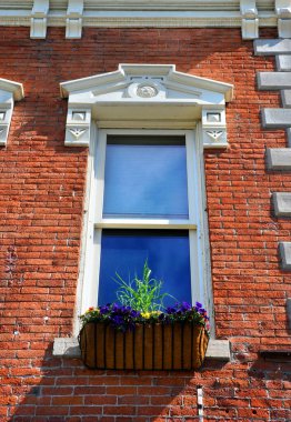 Elegant architecture enhances this window and flower box, in Bozeman, Montana. clipart