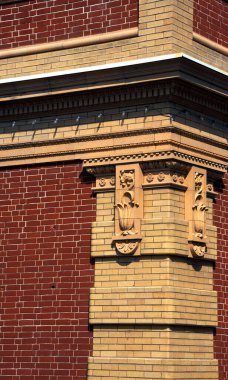 Corner cap on the old train depot in Livingston, Montana has pattern that is repeated on each side of corner. clipart