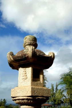 Authentic Japanese stone lantern sits in Liliuokalani Park in Hilo on the Big Island of Hawaii. clipart