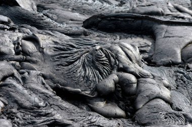 A swirled pool of lava has hardened in the Hawaii Volcanoes National Park on the Big Island of Hawaiil. clipart