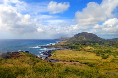 Makapuu Lighthouse Trail overlook has distant view of Diamond Head and the southern shores of Oahu, Hawaii. clipart