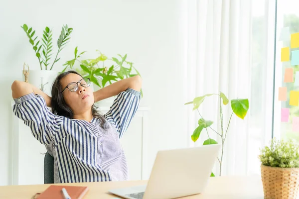 Asia woman touching massage stiff neck after sedentary computer work in incorrect posture, overworking for  long time,  exercises to relieve pain in muscles, Office syndrome concept, Copy space