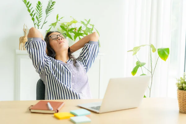 Asia woman touching massage stiff neck after sedentary computer work in incorrect posture, overworking for  long time,  exercises to relieve pain in muscles, Office syndrome concept, Copy space
