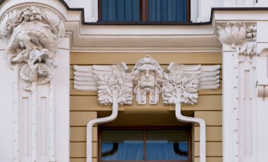 Shot in color detail on the facade of this historic building representing some character, animal or flower. Set at Riga, Letonia, Europe