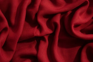 Kırmızı kumaş dalgalı buruşuk arkaplan dokusu.