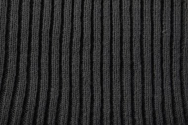 Koyu gri örgü kumaş arkaplan dokusunu kapat.