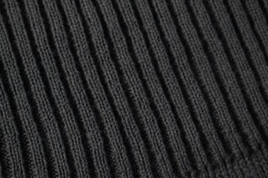 Koyu gri örgü kumaş arkaplan dokusunu kapat.