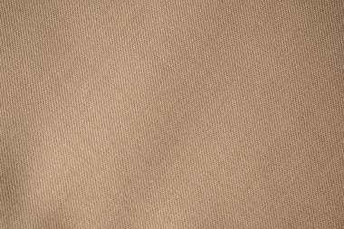 Detaylı düz görünüm Açık kahverengi desenli kumaş dokusu arkaplanı.
