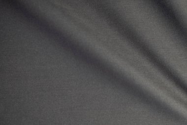 Dalgalı koyu gri kumaş arkaplan dokusu. Parlak, parlak ve zarif arkaplan.