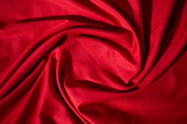 Kırmızı kumaş dalgalı buruşuk arkaplan dokusu kopyalama alanı ile.