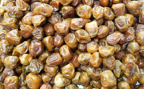 Ağzını sulandıran Bal Söndüren Üst Çerçeve Görünümü Kurutulmuş Tarihler, Masa Üzerinde Ayarlanmış Tarihler, Tarihler