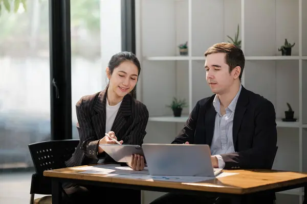 stock image Company CEO and Top Manager Talking, Using Laptop Computer in office office. Two Successful Professional People Brainstorm, Find Solution to Their e-Commerce Software Investment Strategy. High quality