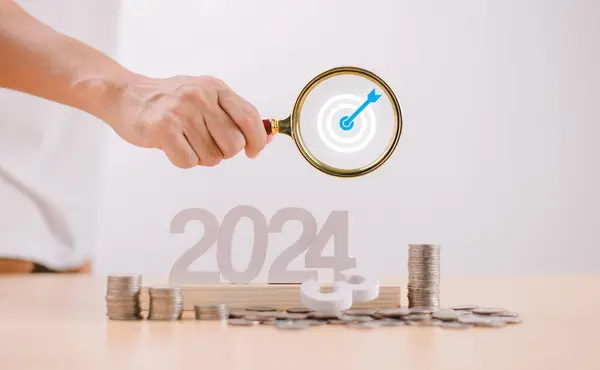 Target Goal challenge concept. Start 2024 plan Money saving, Retirement fund, Pension, Investment Financial. Businessman use magnifying glass, seo marketing. Business survival earning income profit
