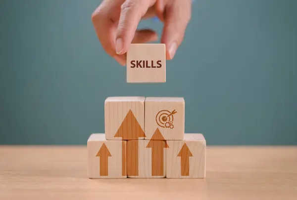Skill development concept. Up new ability skill for technology evolution. Employee thinking, digital upskill. Hand hold wooden cube with digital skill icon. Skill training, education learning concept