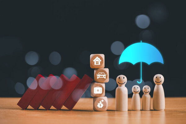 Insurance financial protection service, home mortgage concept. Business financial loan for safety family. Safe risk assessment crisis, blue umbrella with red domino wooden figure. Happy home life tech