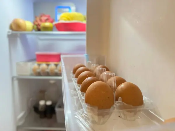 stock image Fresh fruits and eggs in the refrigerator