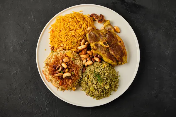Mansaf al-Quzi with nuts and meat, rice with meat and nuts