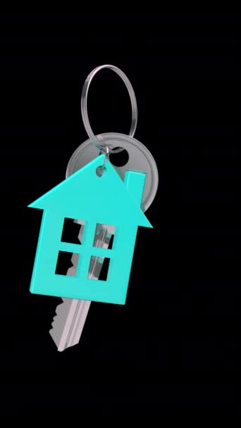 黒い背景の家が付いているキー リングで掛かるキー — ストック動画