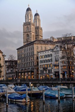 Limmat river in Zurich with Grossmnster cathedral in the back clipart