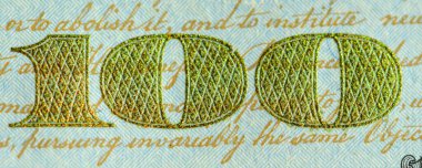 100 dolarlık banknottaki 100 'lü numaranın ayrıntıları.