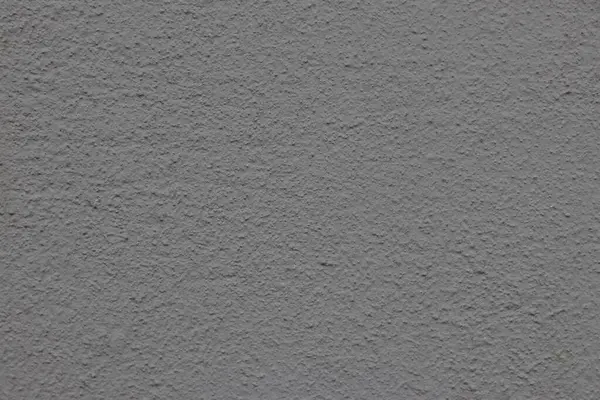 Çizik ve çatlaklarla dolu bir duvar parçası.