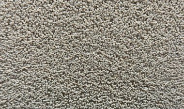 Sıkıca paketlenmiş küçük çakıl taşlarından oluşan hafif tanecikli bir yüzeye yakın çekim. Mimari görselleştirmeler, manzara tasarımı, inşaat malzemesi sunumları için ideal bir yapı.