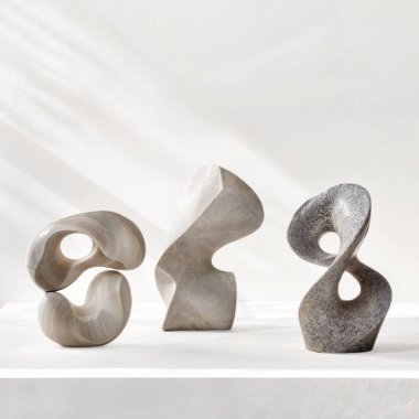 three modern contemporary stone sculptures, isolated, white background clipart