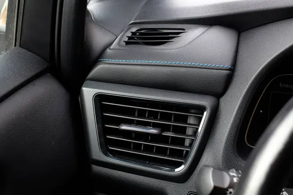 Air vents in electric vehicle. Deflector. Car ventilation system. Car air conditioner. Car ventilation vent. Electric car interior.