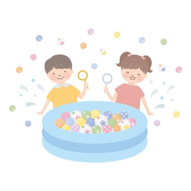 Renkli lastik topları kepçeleyen çocuk