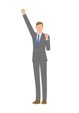 İş elbisesi içinde gülümseyen genç adam: Yumruk pompasıyla kollarını kaldırıyor.